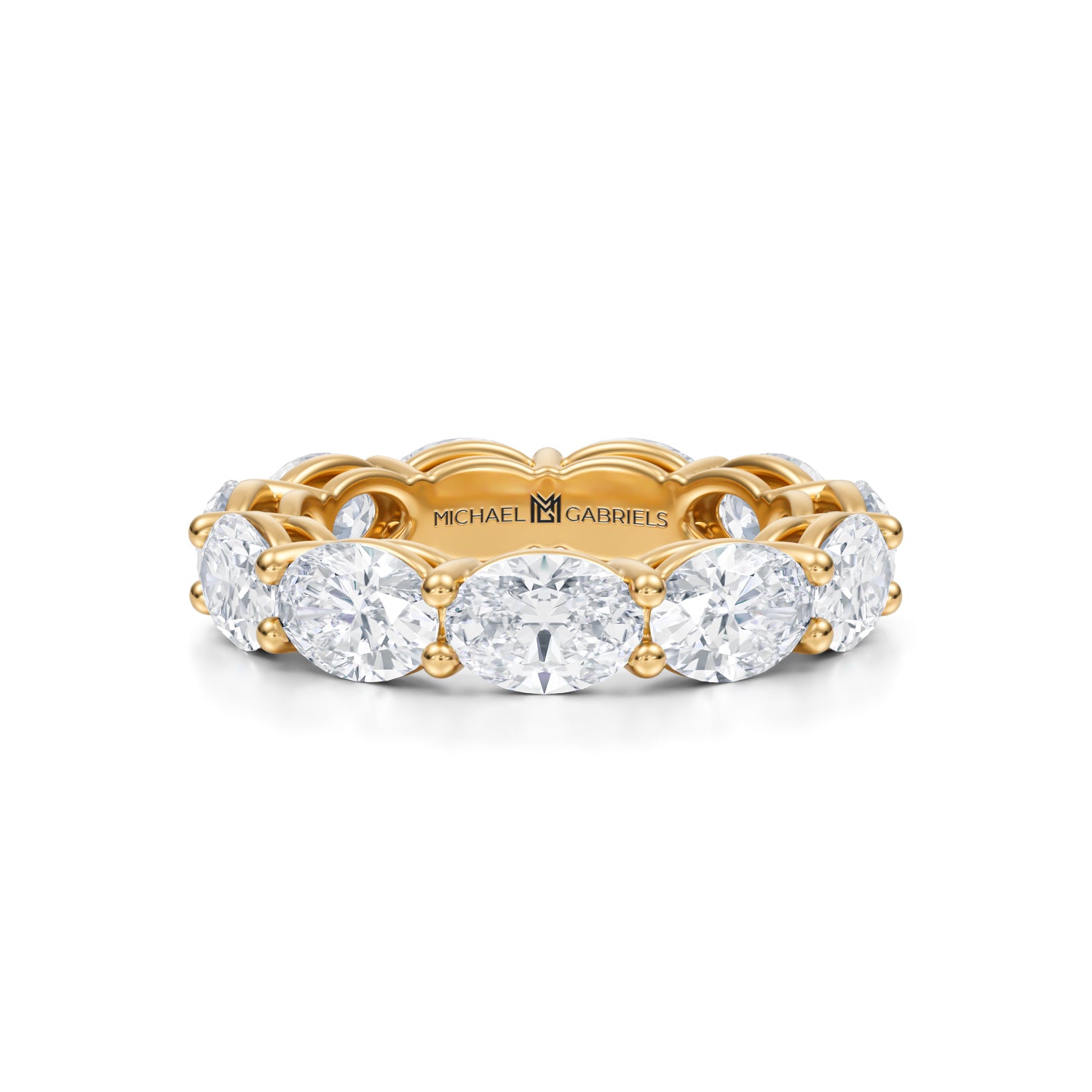 Yellow gold eternity band with lab-grown diamonds in horizontal oval shape.