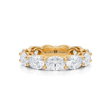 Yellow gold eternity band with lab-grown diamonds in horizontal oval shape.