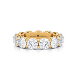 Yellow gold eternity band with lab-grown diamonds.