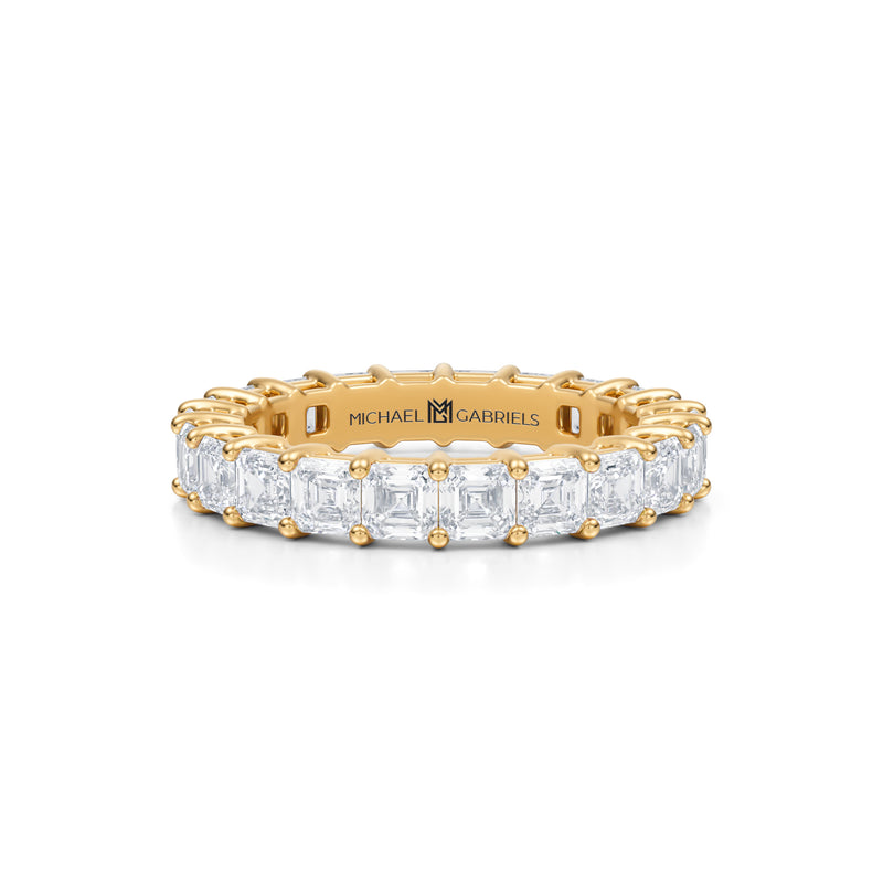 Petite eternity band with Asscher cut lab grown diamonds in yellow gold.