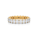 Petite eternity band with lab-grown diamond in yellow gold.