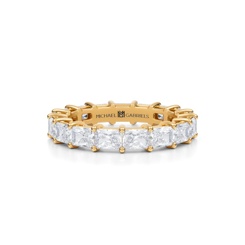 Petite eternity band with lab-grown diamonds in yellow gold.