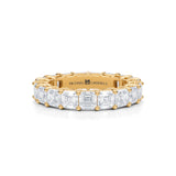 Small eternity band with Asscher cut lab grown diamonds in yellow gold.