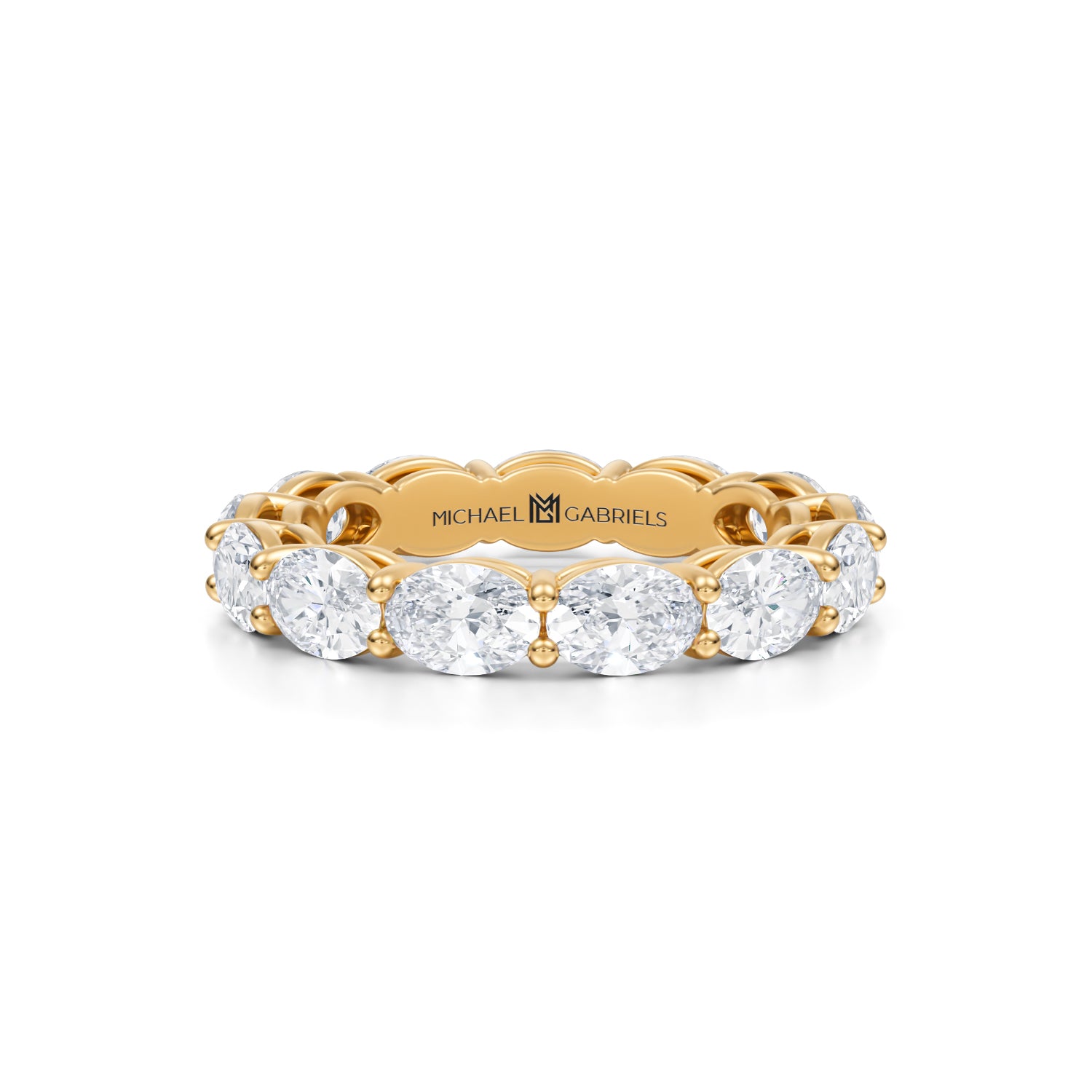 Small lab-grown diamond eternity band in yellow gold.