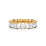 Yellow gold eternity band with princess cut lab grown diamonds.