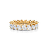 Small yellow gold eternity band with slanted pear lab-grown diamonds.