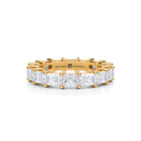 Radiant diamond eternity band in yellow gold.