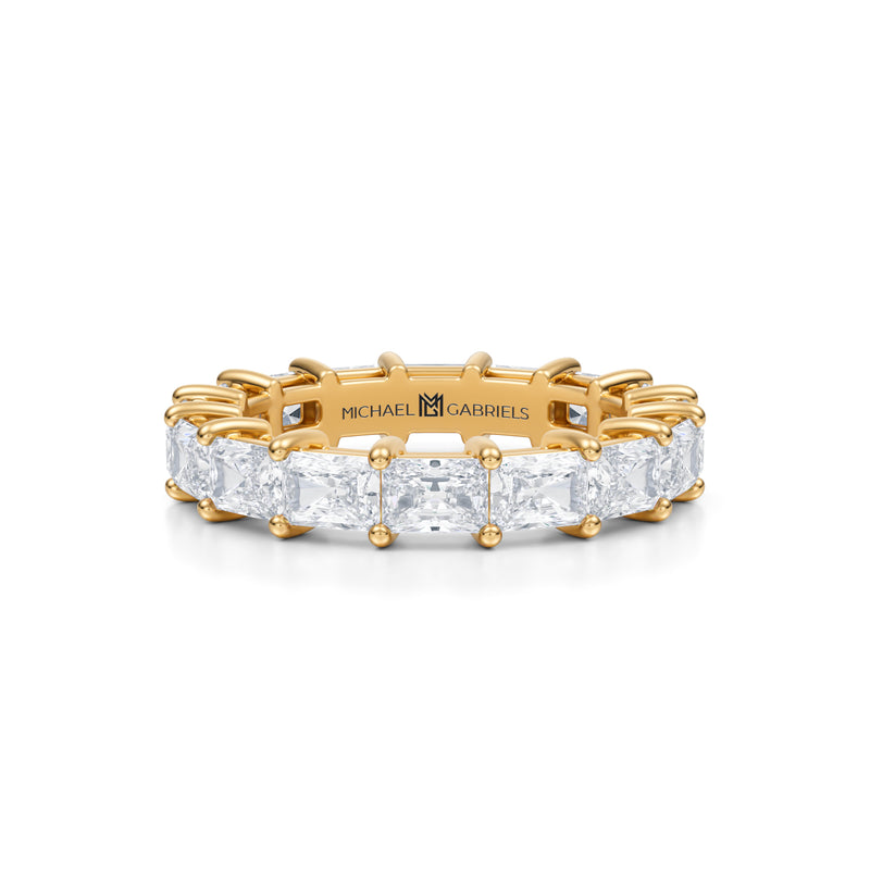 Radiant diamond eternity band in yellow gold.